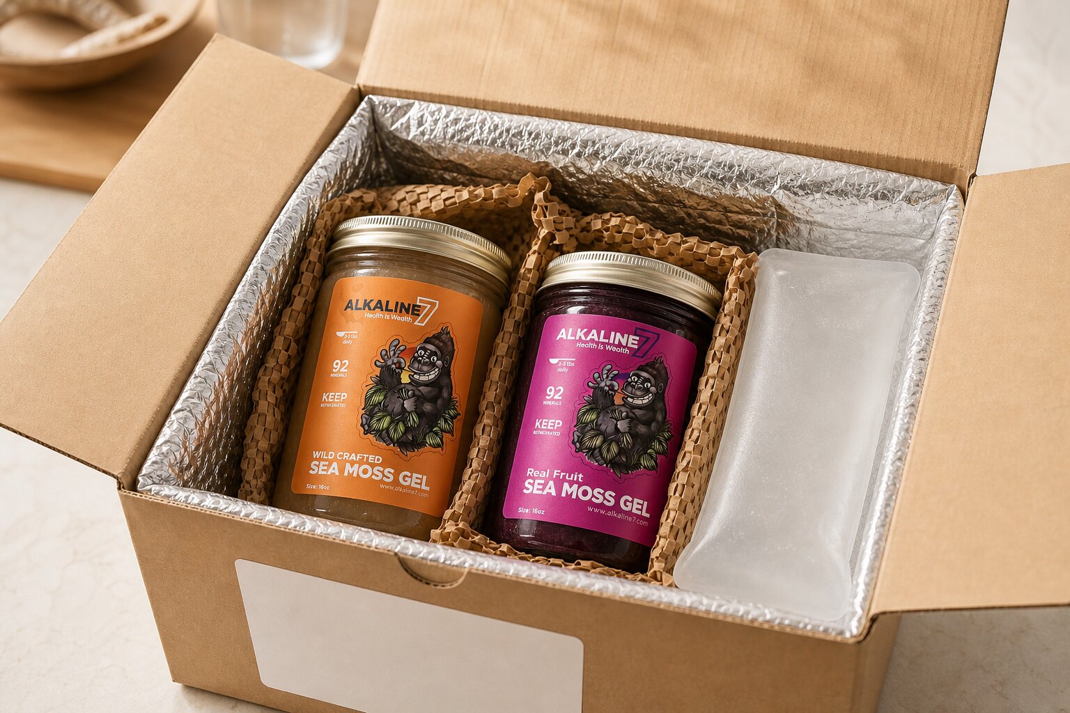 Plain and berry Alkaline7 jars packed with insulation and a blank cold pack.